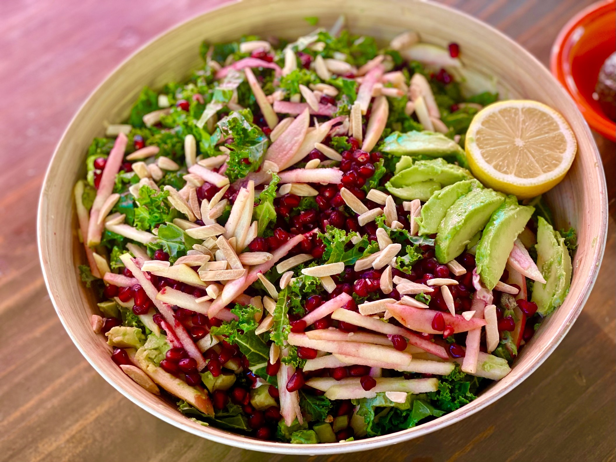 A stylized photograph of a Festive Kale Salad