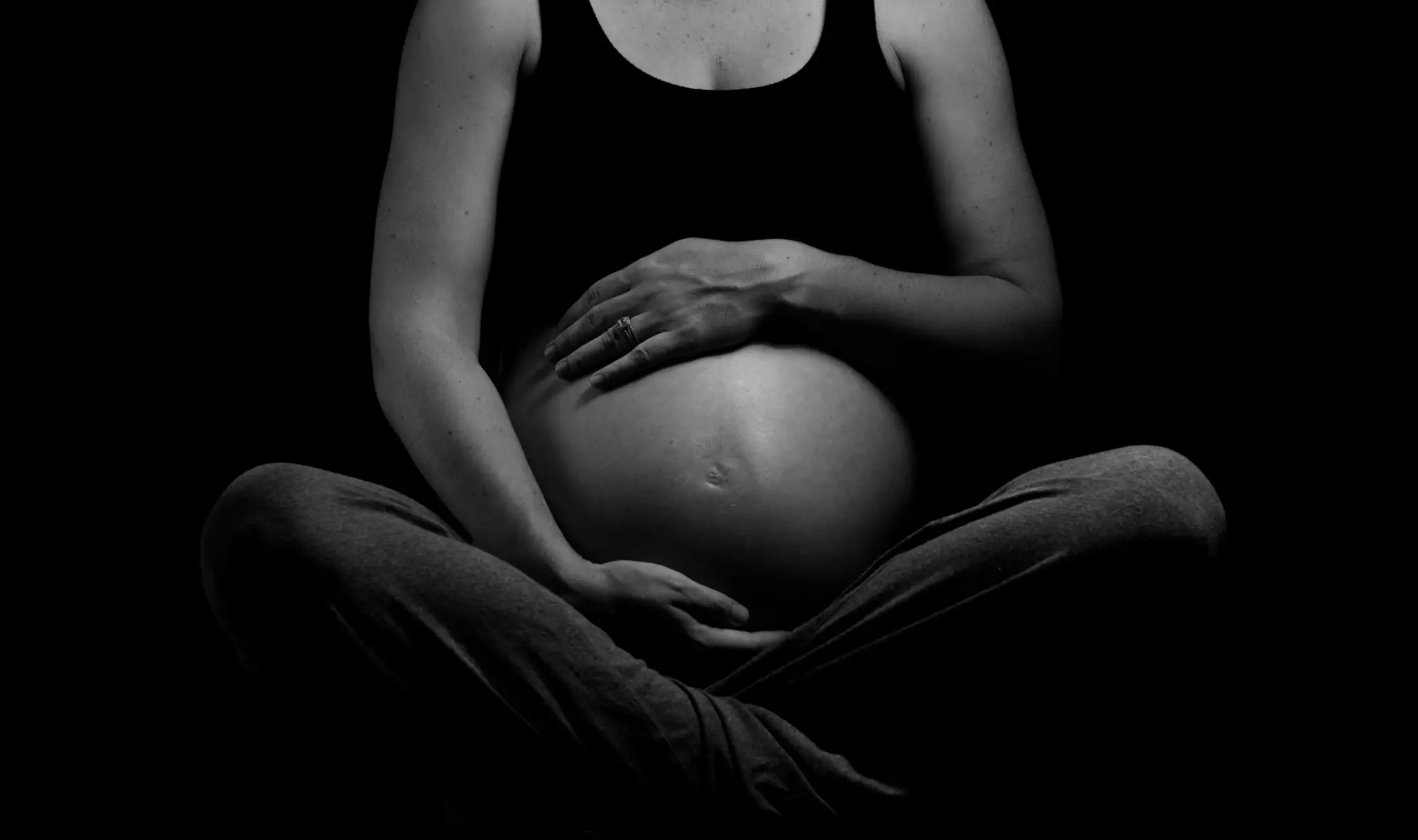 Woman at 36 weeks pregnant (no face shown)